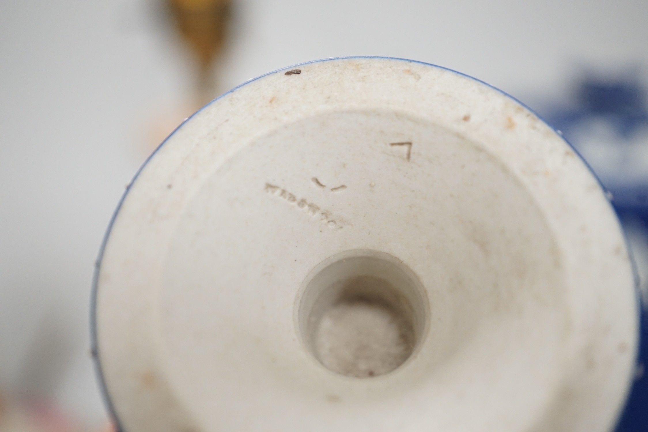 Three mid to late 19th century pieces of Wedgwood Jasperware, including a coffee pot and a small cache-pot, a pair of 19th century porcelain candlesticks converted into lamps
